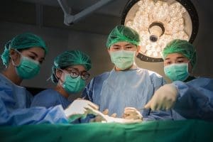 Doctor and Surgery team operating in a surgical room