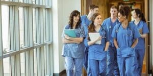 A group of 6 BSN students walking down a hallway.