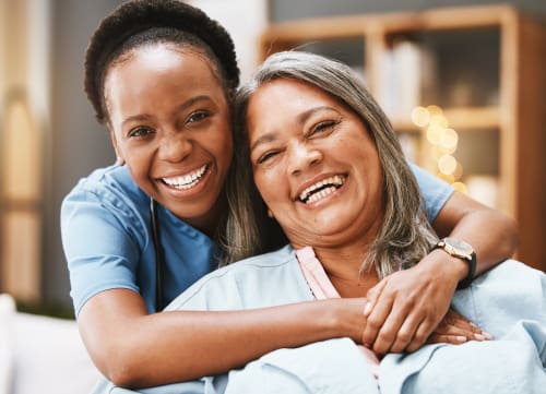 Nurse giving a patient a hug