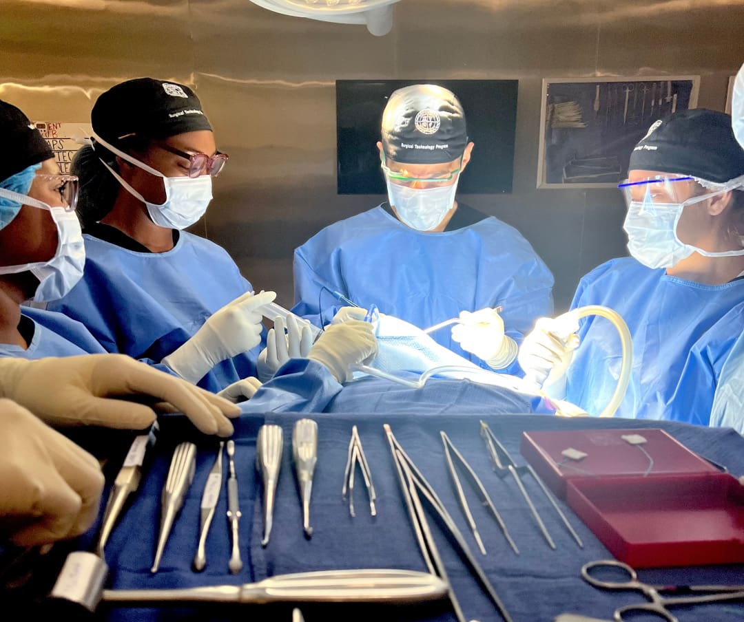 CNI College surgical technology students in a practice operating room